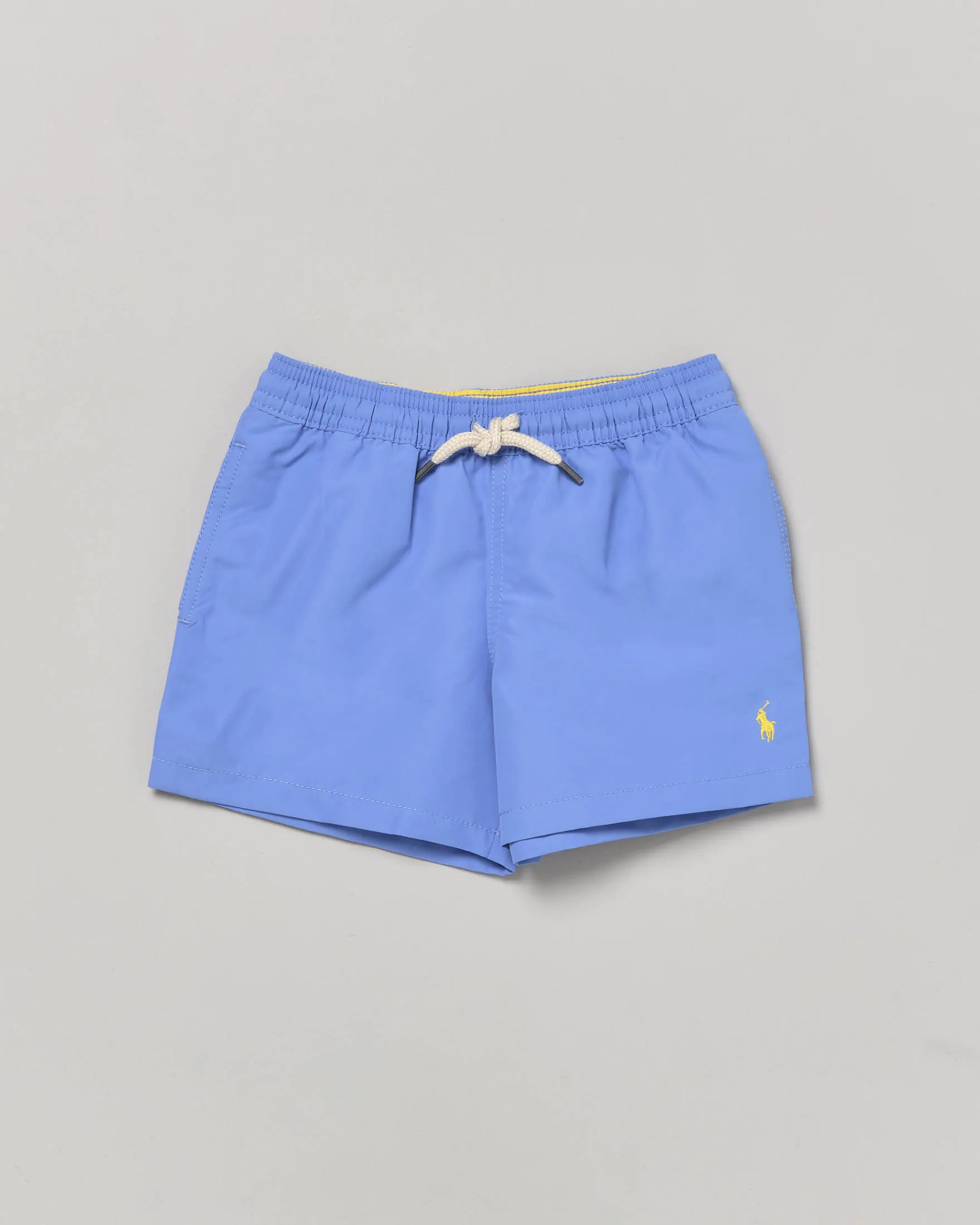 Boxer mare azzurro con logo pony giallo e taschino sul retro 2-6 anni