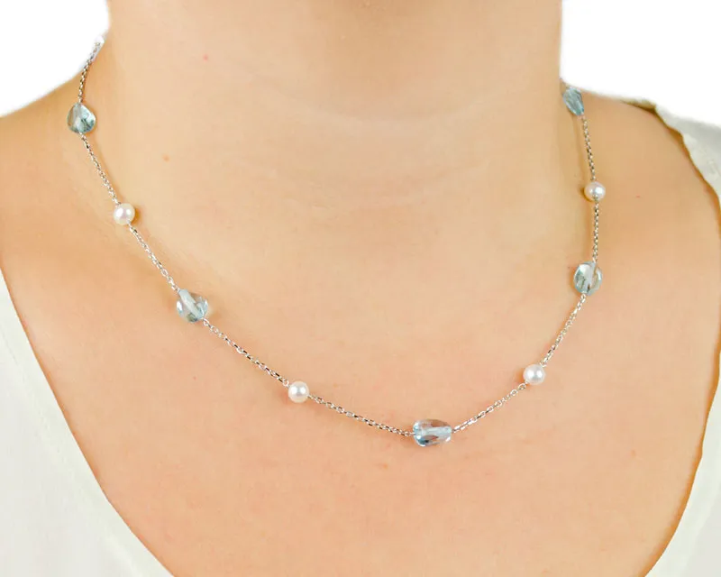 Collana con topazio azzurro e perle in oro bianco